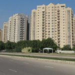 Stunning exterior view of the fully renovated Creek Vista apartments in DHA Phase 8 Karachi, showcasing modern architecture against a scenic backdrop